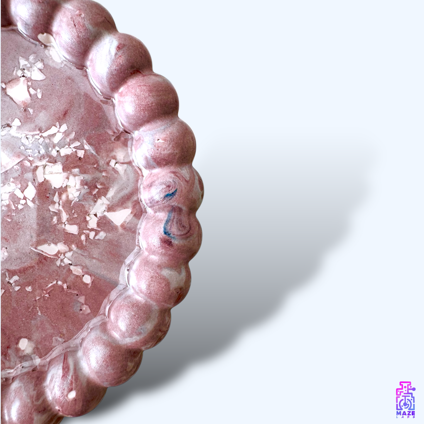 Close-up of the BLIQ round tray, highlighting the handcrafted texture and detailed finish.