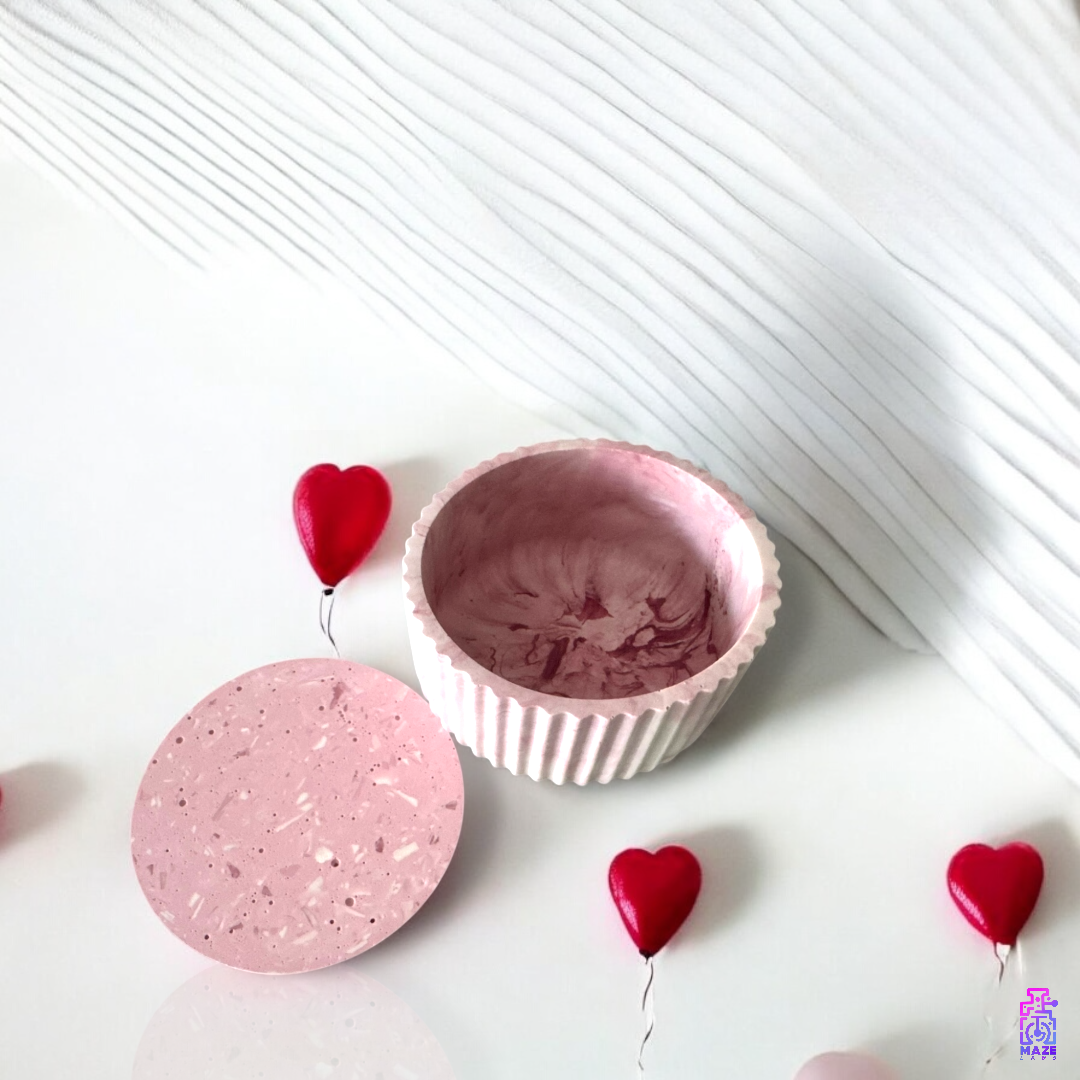 FLIK dual-purpose jesmonite jar with an open lid, showcasing its textured finish and repurposed use as a storage container, styled with red heart decorations.