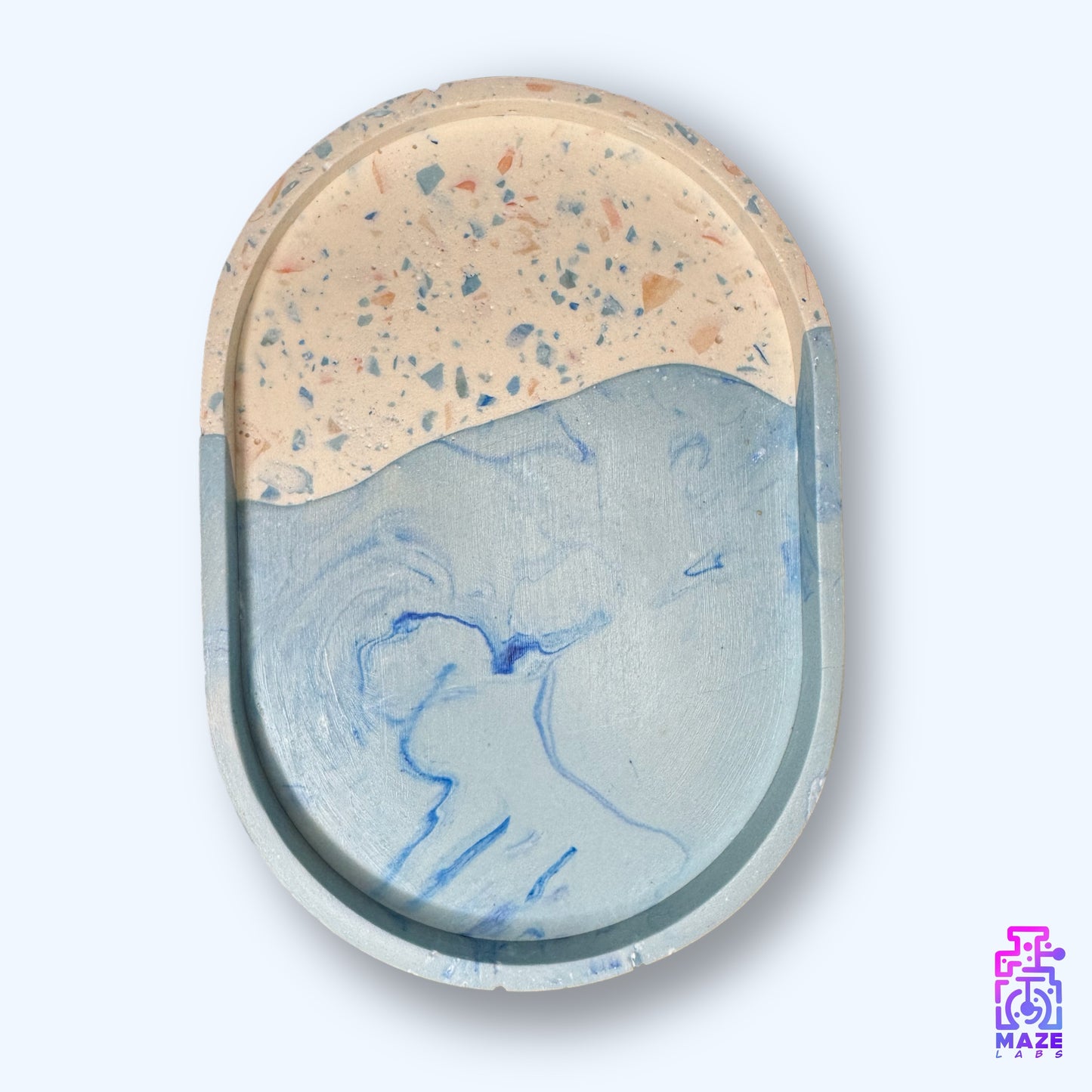 Top view of the OVI tray, showing its polished surface and handcrafted material texture in beige and blue.