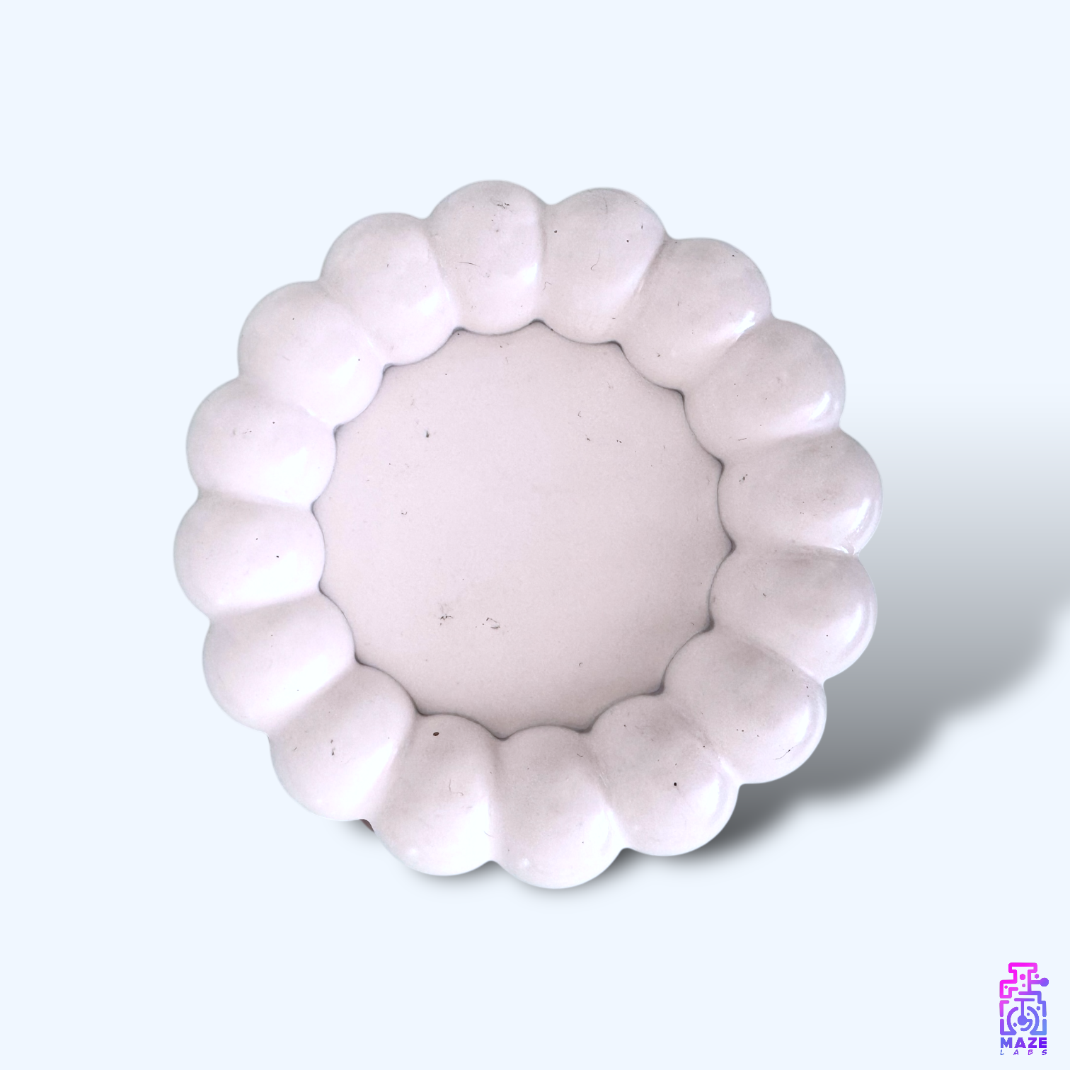 Flat top-down view of the BLOQ tray, emphasizing its smooth surface and refined finish.