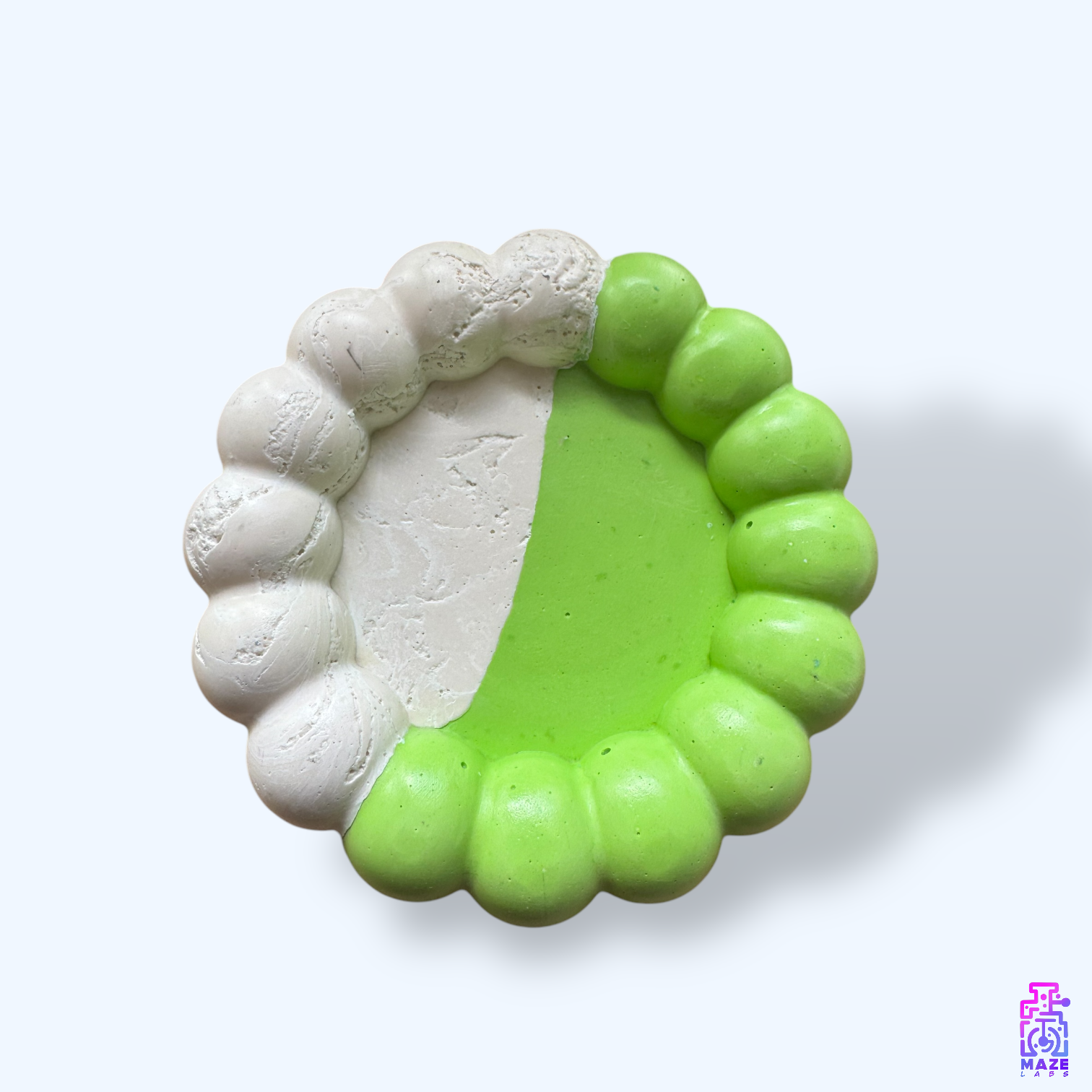 Top-down view of the BLOQ tray, showcasing its fluid form and storage surface.