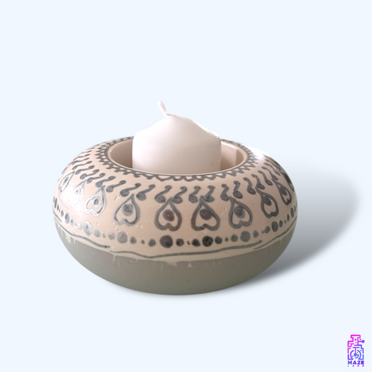 DENSO medium-sized candle holder made from eco-friendly jesmonite, shown with a candle inside.