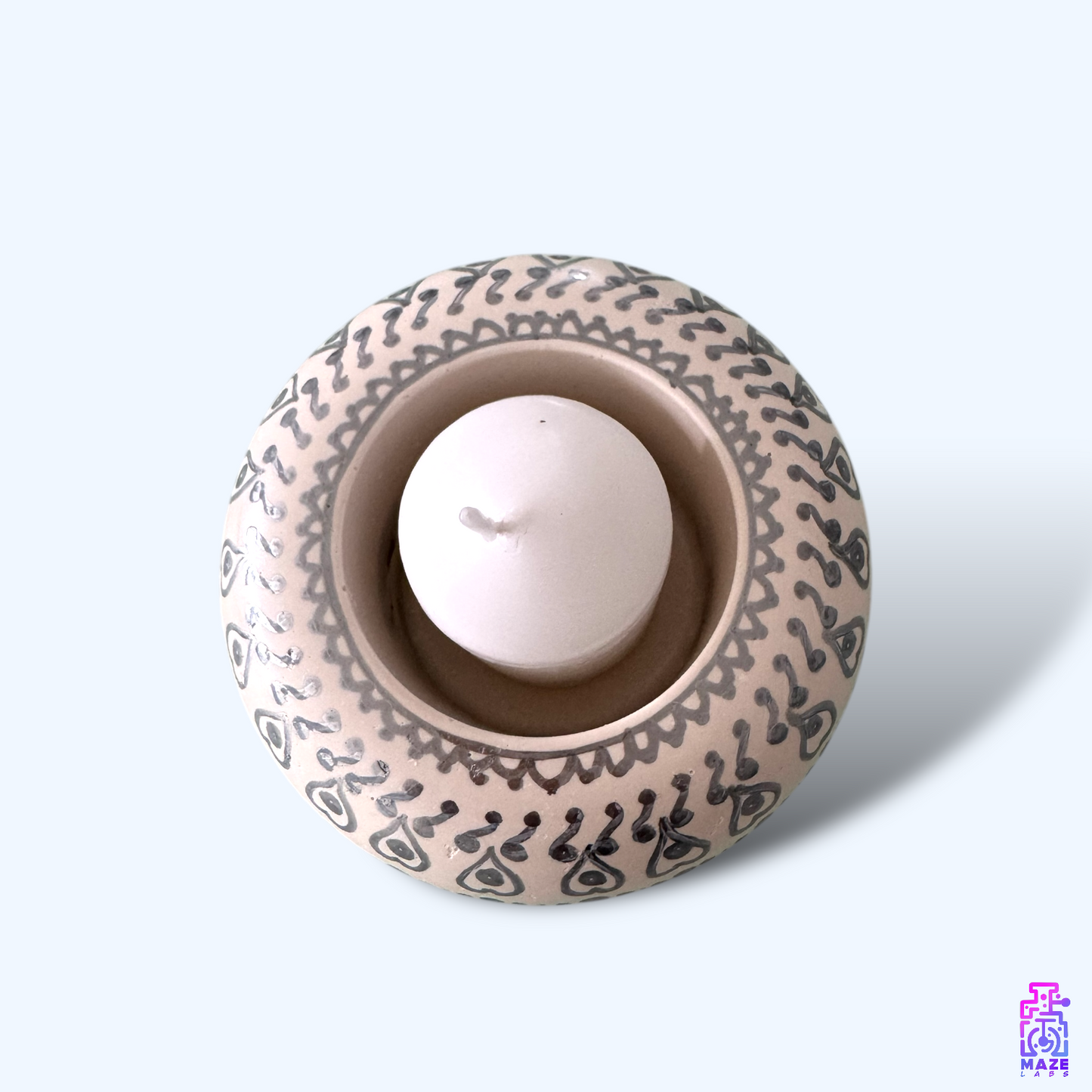 Top-down view of the DENSO candle holder, showcasing its rounded design and included candle.