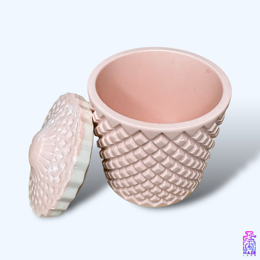 A large Jesmonite jar with a geometric lid, ideal for storing small essentials and home decor.