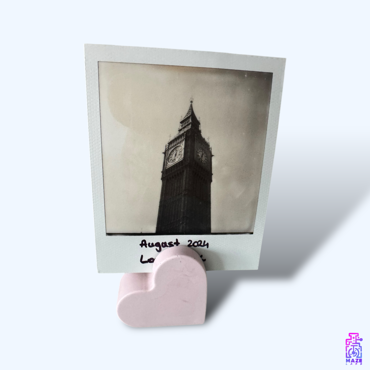 Angled view of the KALB photo holder with a black-and-white picture, placed in a well-lit setting.