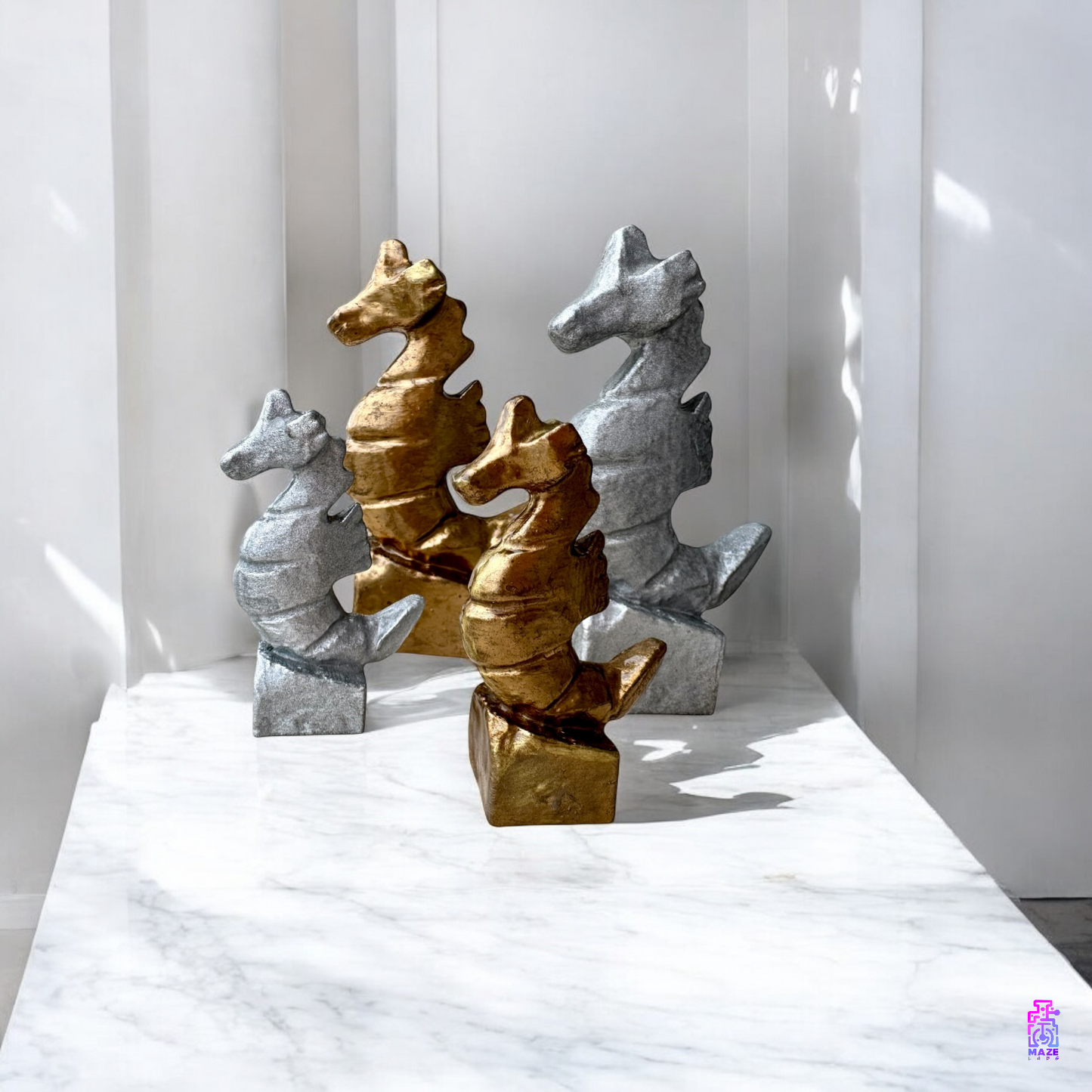 KUDAKAI seahorse statuettes placed on a white shelf in a minimalist coastal-themed interior.