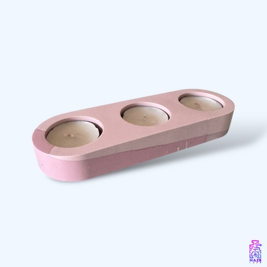 LUNOS triple tealight candle holder, handmade from eco-friendly jesmonite. Shown at an angle with three included candles, perfect for modern decor.