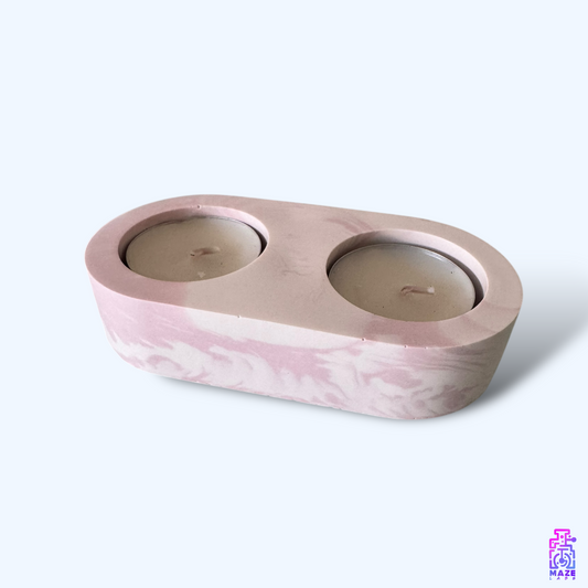  LUNO double tealight candle holder, handmade from eco-friendly jesmonite. Shown at an angle with two included candles, perfect for modern decor.
