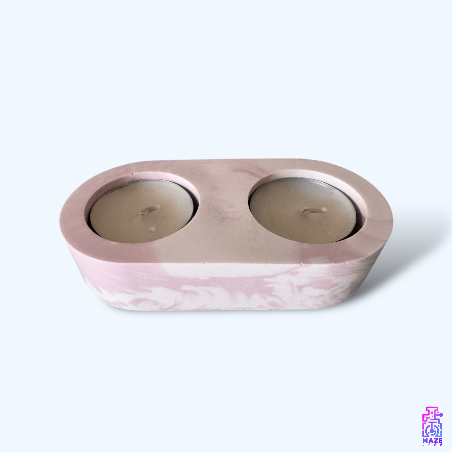 LUNO double tealight holder made from eco-friendly jesmonite, featuring a marbled pink and beige texture, displayed on a clean white background.