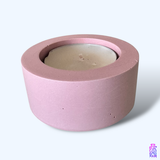 LUN single tealight candle holder made from dark pink eco-friendly jesmonite, displayed on a clean white background with a candle.