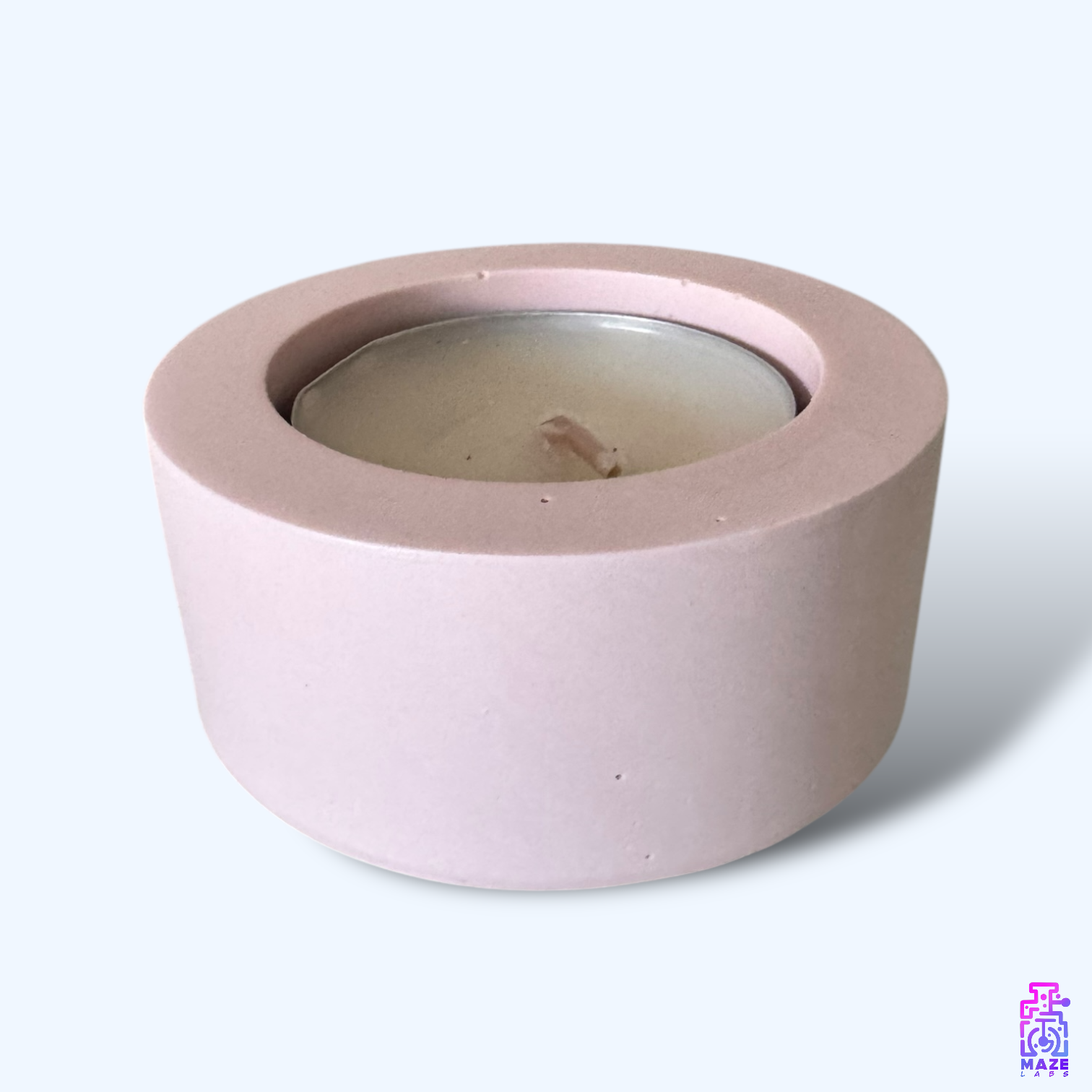 LUN single tealight candle holder in dark pink jesmonite, shown from a side angle to highlight its smooth matte finish and round minimalist design.