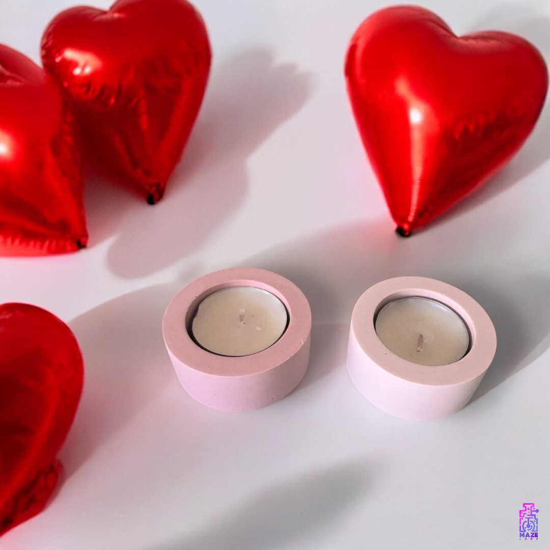 LUN single tealight candle holders in dark pink and light pink jesmonite, styled with red heart balloons for a romantic gift setup.