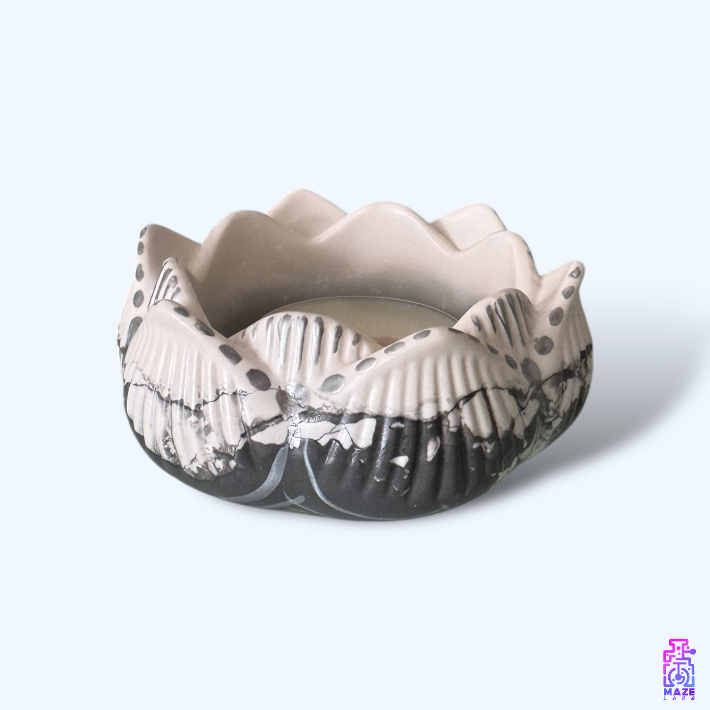 NALA small tealight holder made from eco-friendly jesmonite, shown with a tealight candle inside.