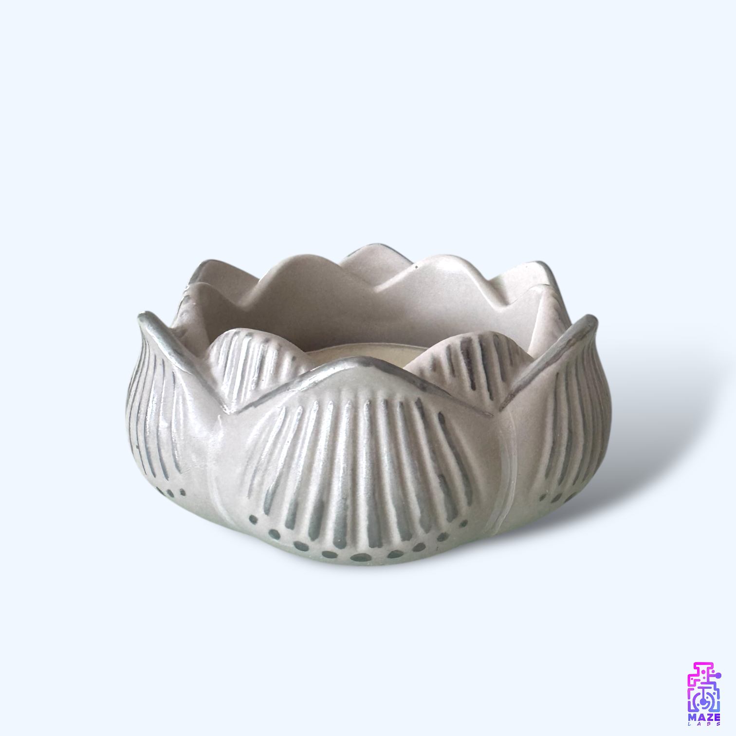 Side view of the NALA tealight holder, highlighting its sculpted form and handmade details.