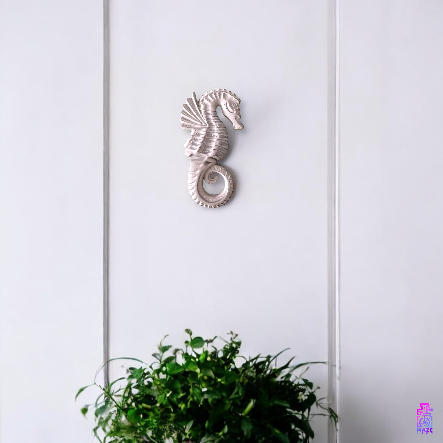 NERE seahorse wall sculpture mounted on a wall, styled in a nautical-themed interior.