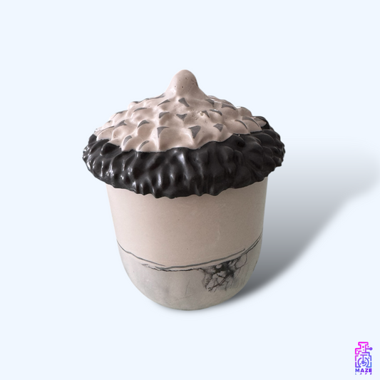 NOKT storage jar made from eco-friendly jesmonite, featuring an acorn-inspired design and textured lid.