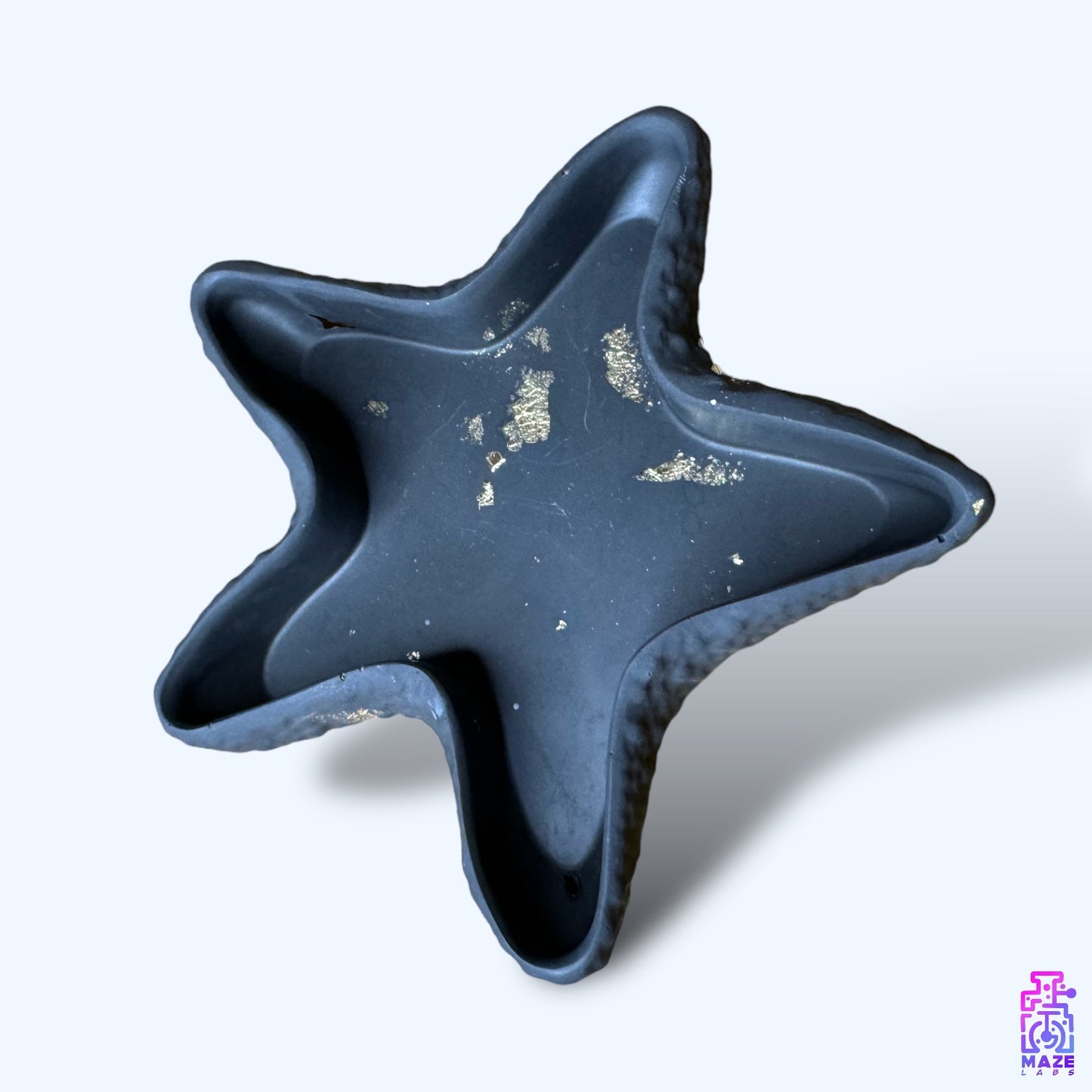 ORIX starfish tray made from eco-friendly jesmonite, featuring a dusty black finish with marbled details.