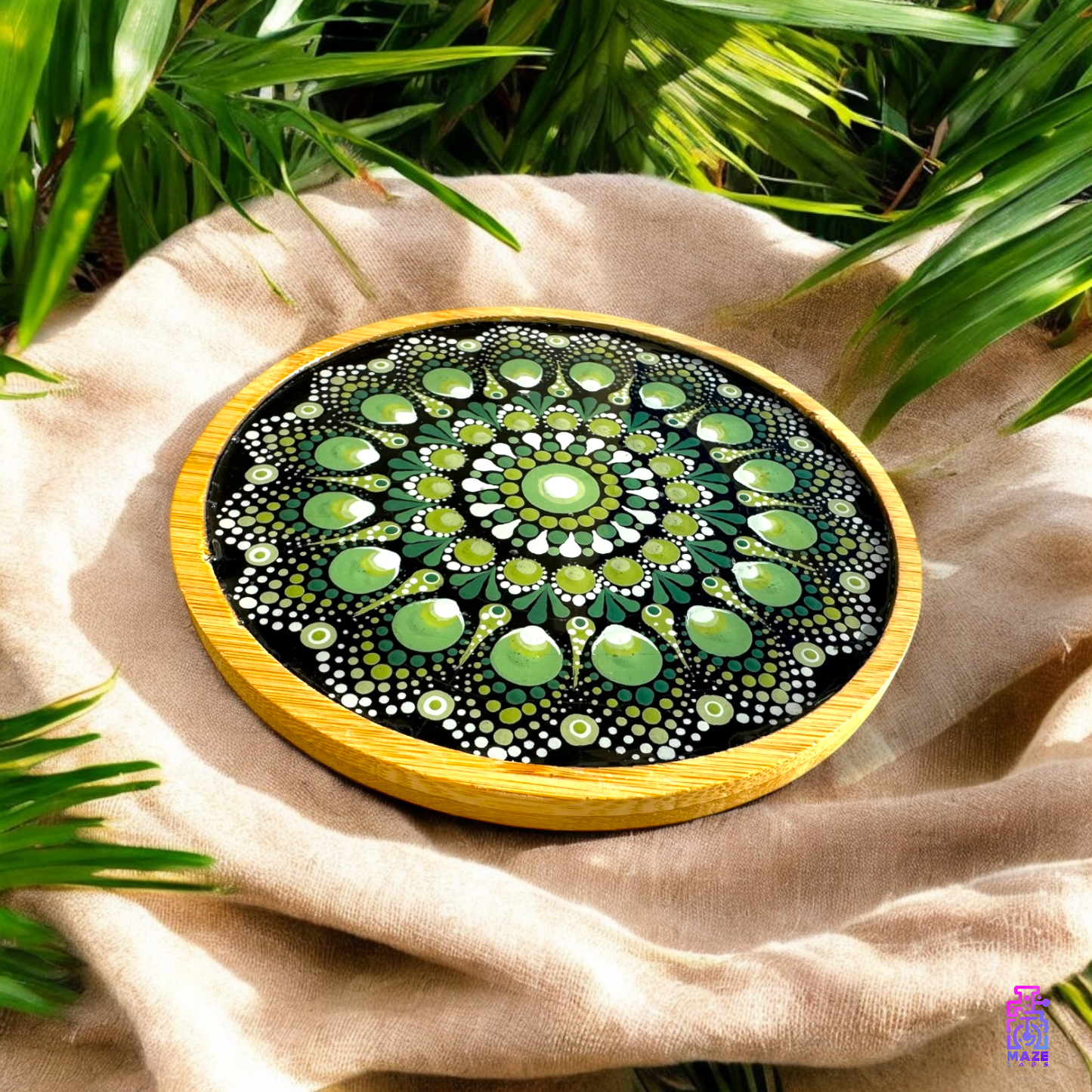 Angled top-side view of the ROOT wooden tray, highlighting the detailed green mandala artwork and smooth bamboo rim.