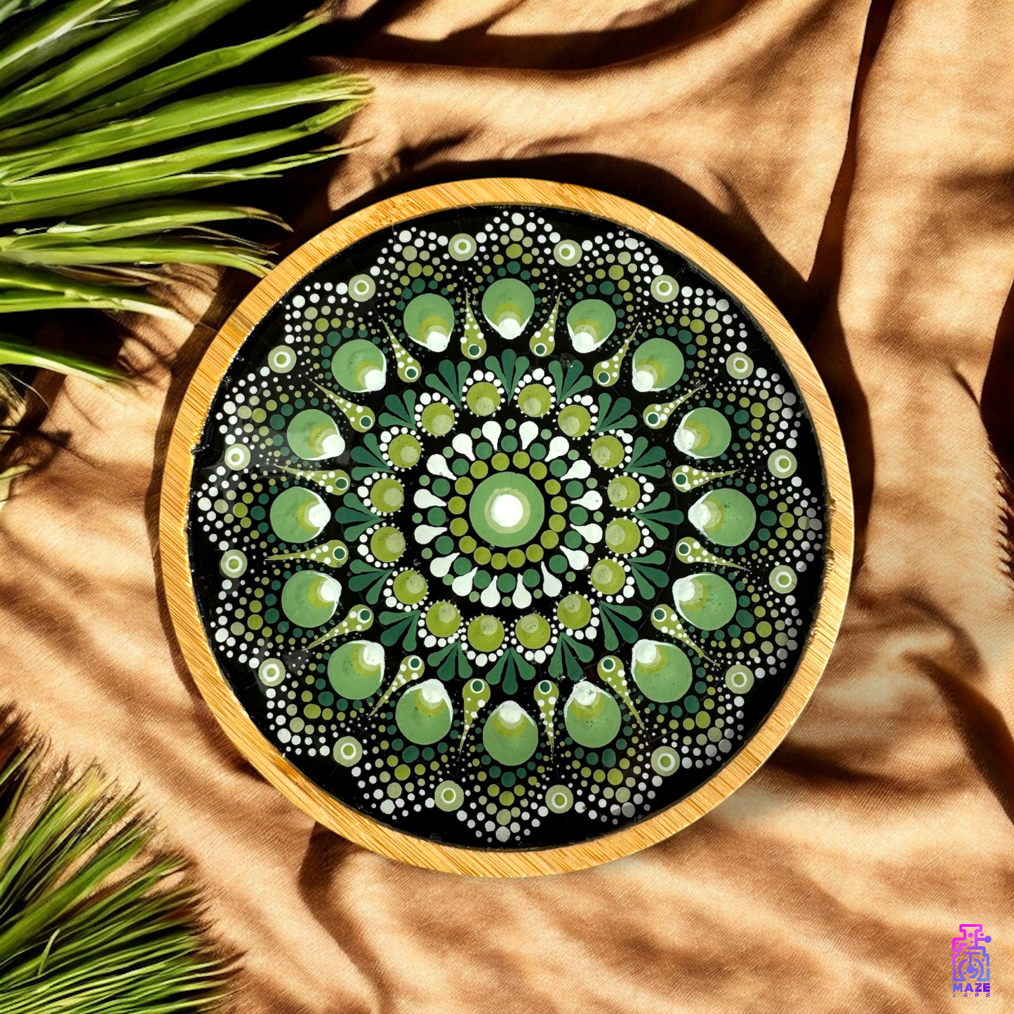 ROOT wooden tray displayed on satin fabric with greenery, emphasizing its artistic and bohemian appeal.