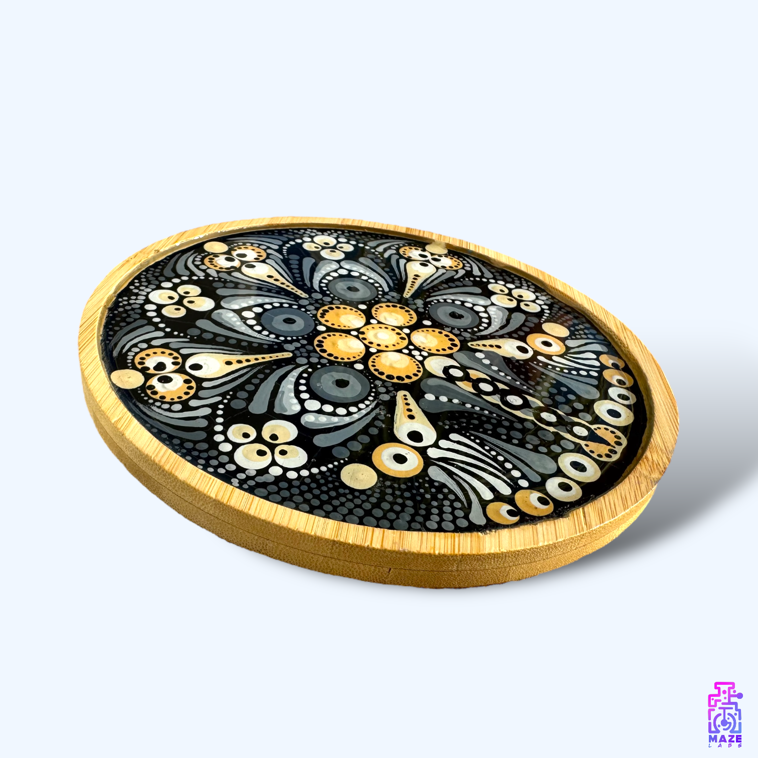 Side view of the ROOT wooden tray, highlighting its black and light brown mandala pattern and sturdy bamboo rim.