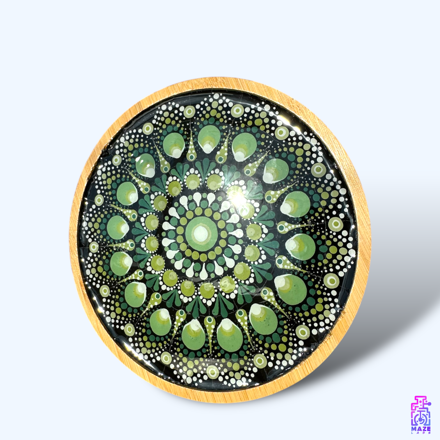 Top-down view of the ROOT tray, showcasing its detailed green mandala hand-painted design on a bamboo base.
