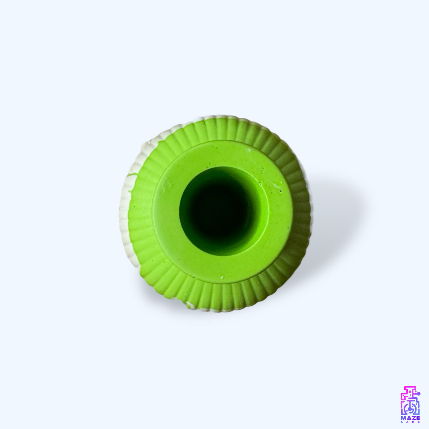 Top-down view of the VESO vase, showcasing its circular opening and deep green ribbed surface.