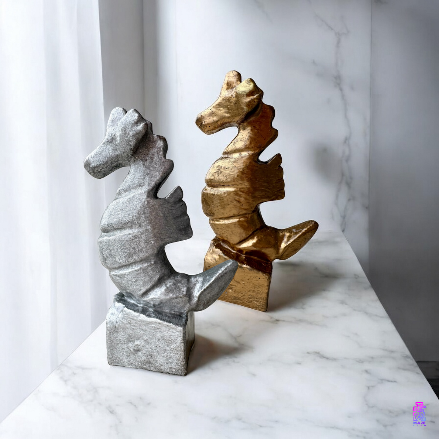 Side view of two KUDAKAI seahorse statuettes placed on a countertop, highlighting their sculptural form and decorative appeal.